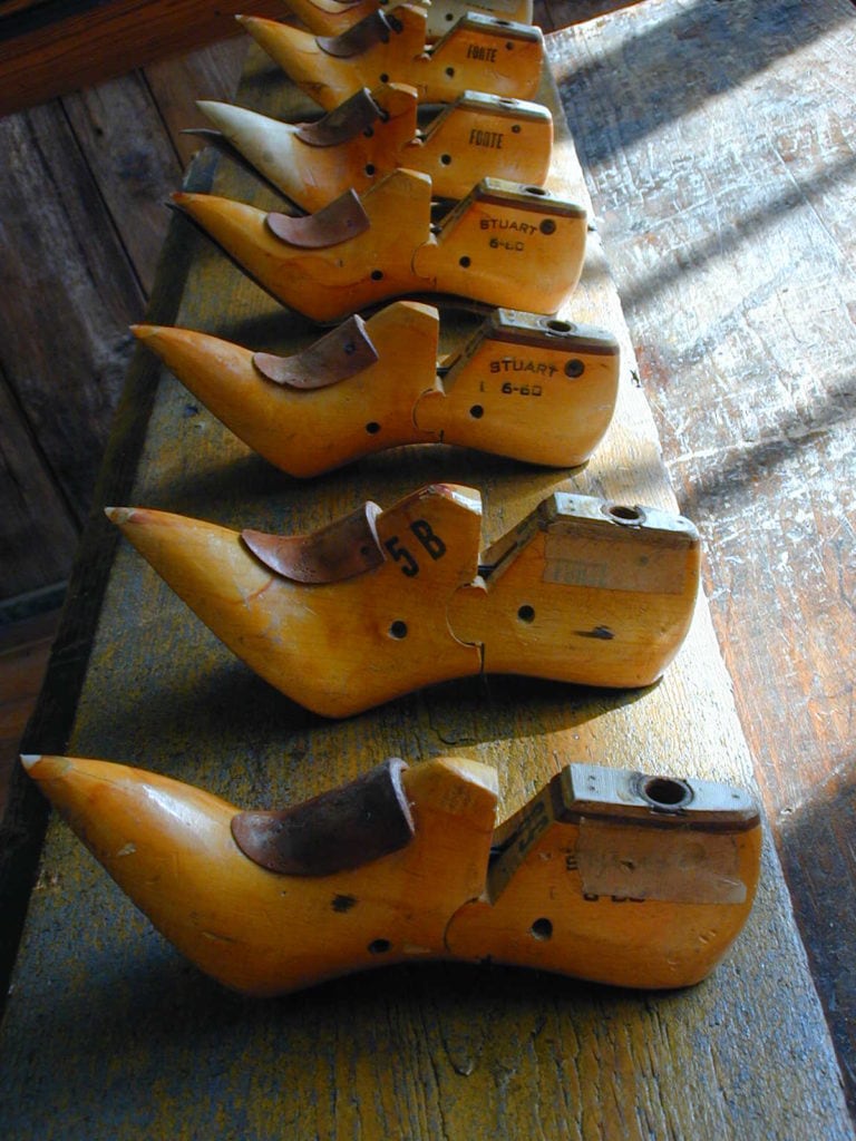 A coat rack made from antique shoe lasts salvaged from a mill in Lawrence, Massachusetts.