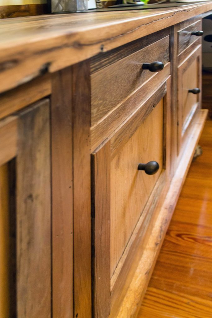 Reclaimed skip-planed oak cabinets by Hawkeye Carpentry.