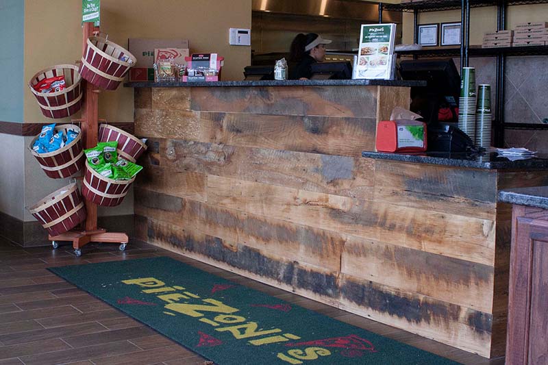 PieZoni's Restaurant Reclaimed Skip-Planed Mixed Hardwoods Paneling in Franklin, MA. Finished with Water-Based
