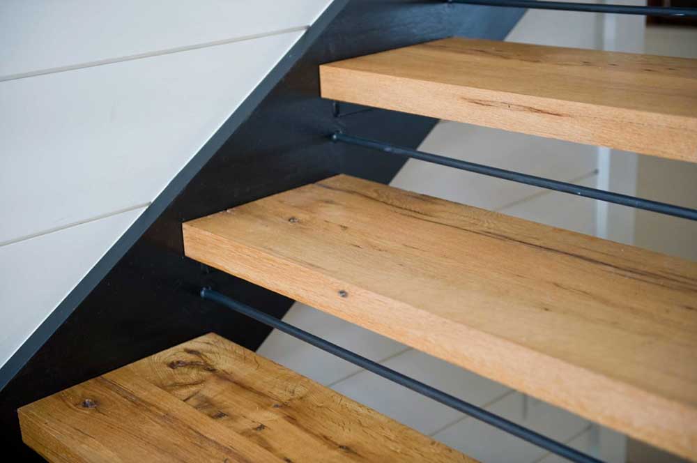 Reclaimed custom-milled oak stair treads for a Maine private residence.