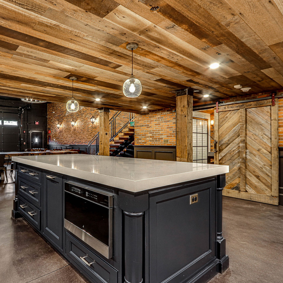 Reclaimed Wire-Brushed Paneling & Barn Doors and Hand-Hewn Column Wrap - Boston Scally Co.