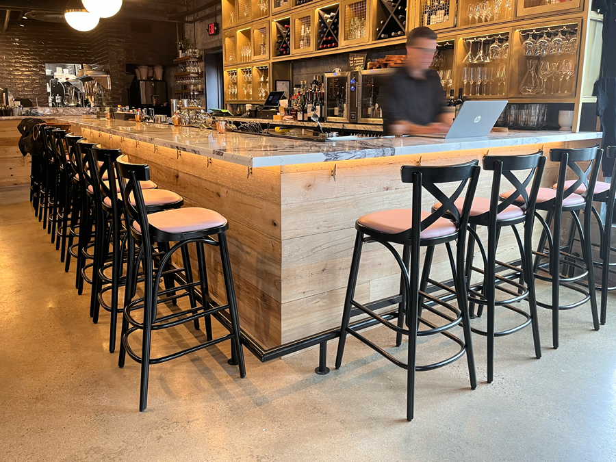Reclaimed maple paneling on restaurant bar front