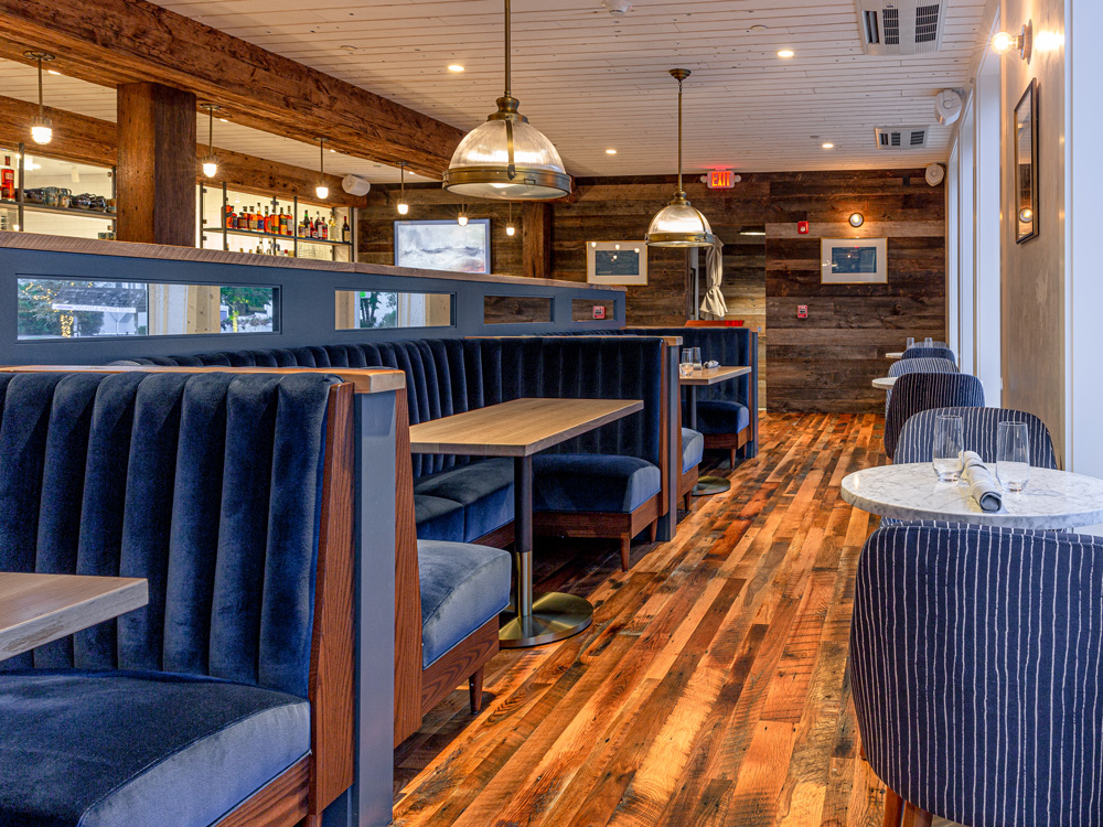 Connecticut Restaurant With Barn Board Paneling, Skip-Planed Oak Flooring, and Mushroom Wood Beam Cladding